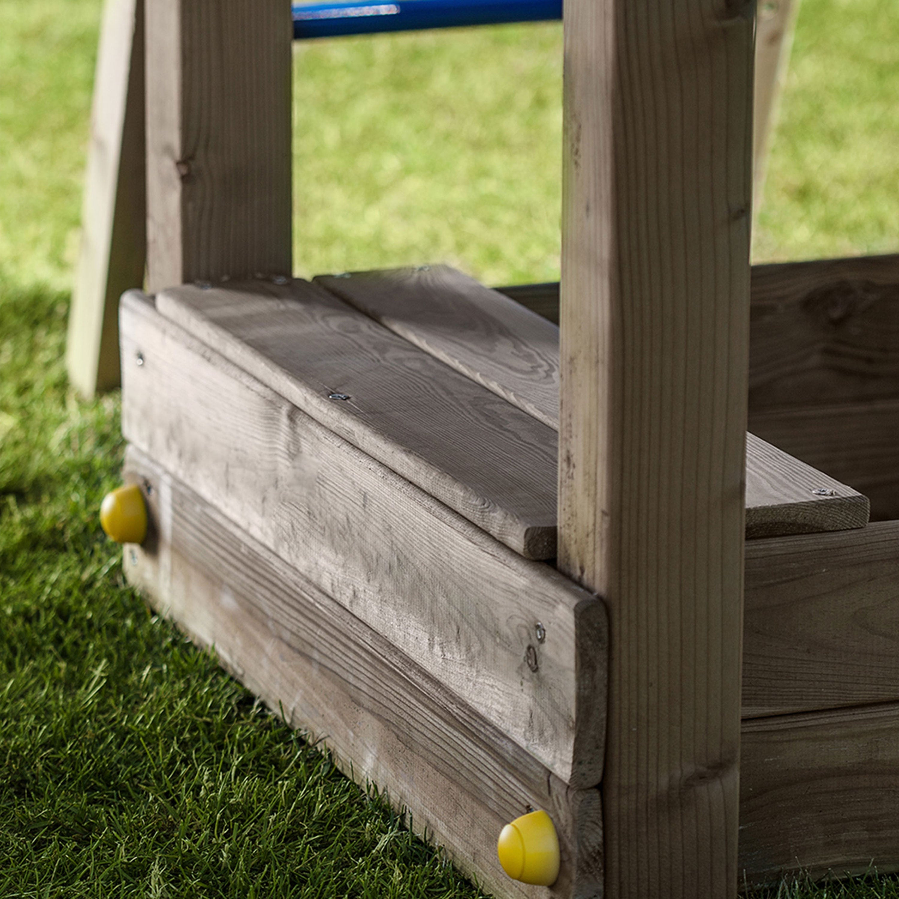 Climbing frame Rumble Ridge Rock Wall featuring single swing and slide - Best Shed